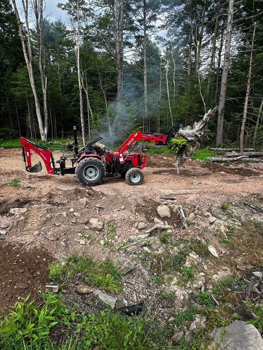Tractor clearing land