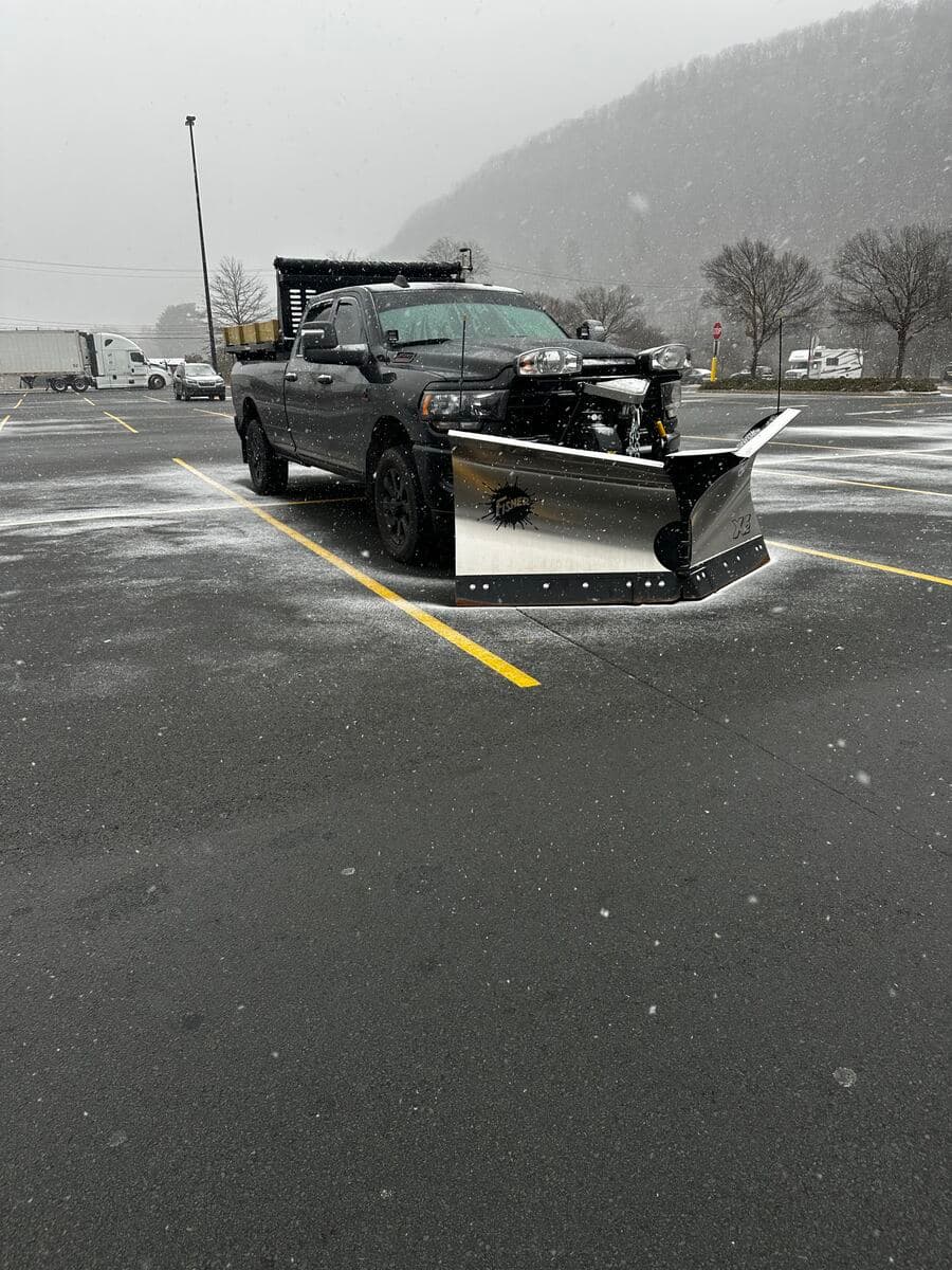 Snowplow clearing a driveway